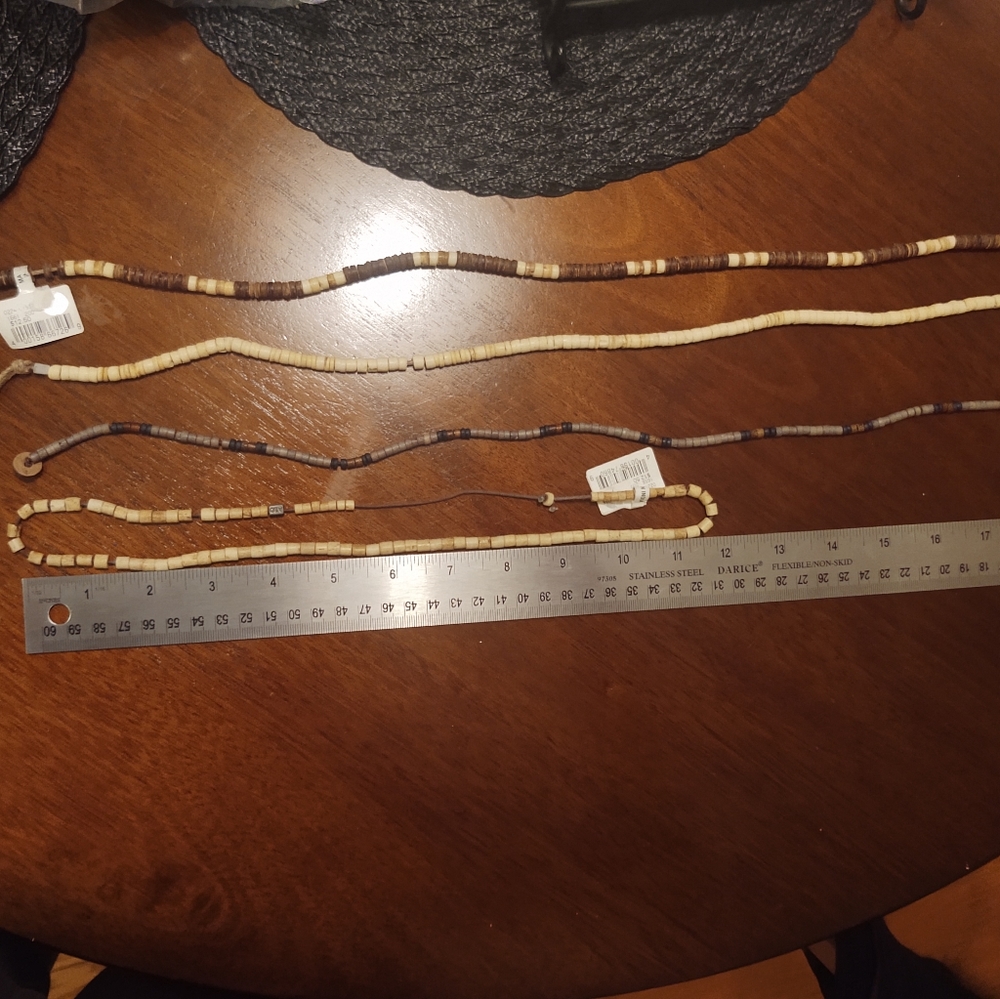 Four American Eagle necklaces